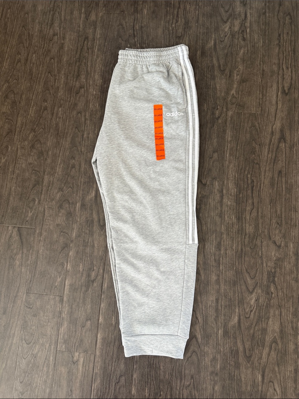 adidas Light Gray Joggers with White Side Stripes and Orange Accent